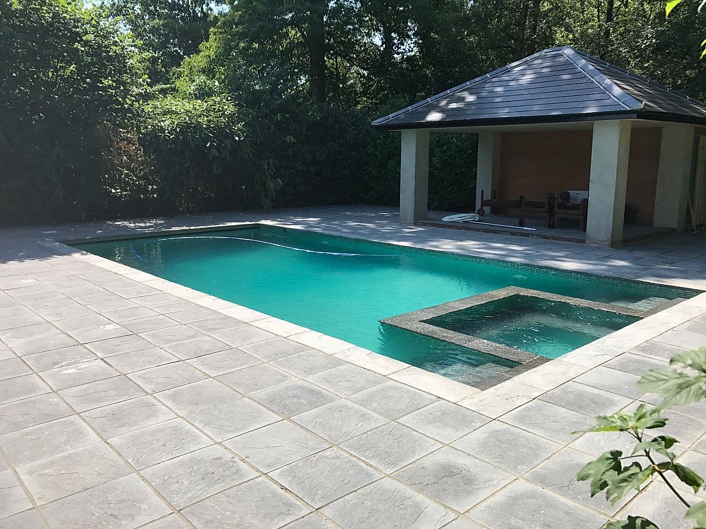 Concrete Outdoor Swimming Pool & Spa Combo With Outdoor Kitchen by UK Swimming Pools Ltd Concrete Outdoor Swimming Pool & Spa Combo With Outdoor Kitchen by UK Swimming Pools Ltd