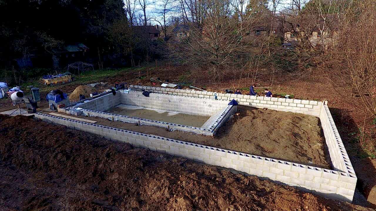 a wide angle view of the pool and surroundings - showing the size of the project