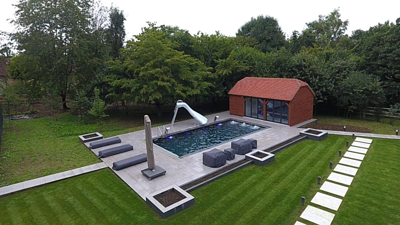 Finished shot of this Luxury Swimming Pool with the water fountains and underwater lights turned on