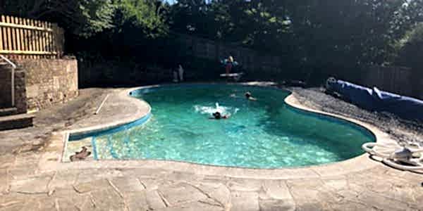 Old kidney shaped swimming pool