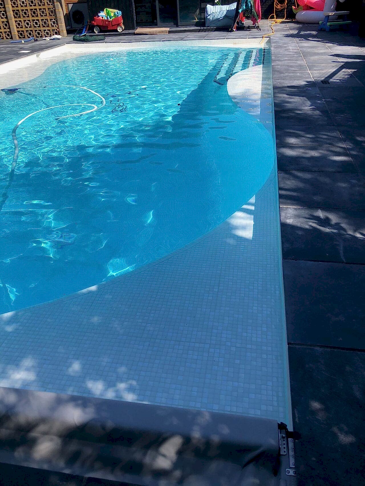 The surrounding pool deck was repaved according to the clients’ vision and