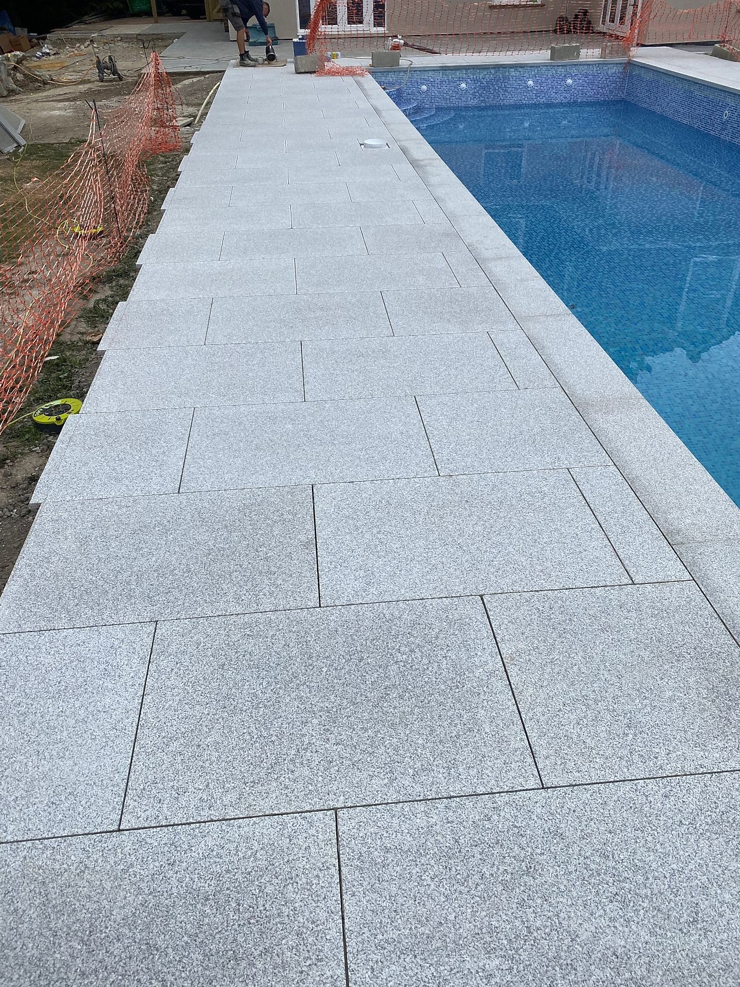 The complex renovation resulted in a completely transformed luxury pool