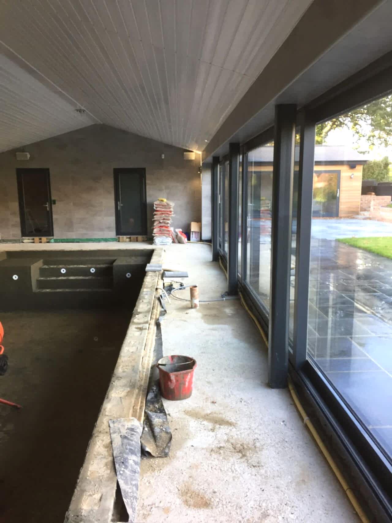 Double-glazed door systems flood the space with natural light and ventilation