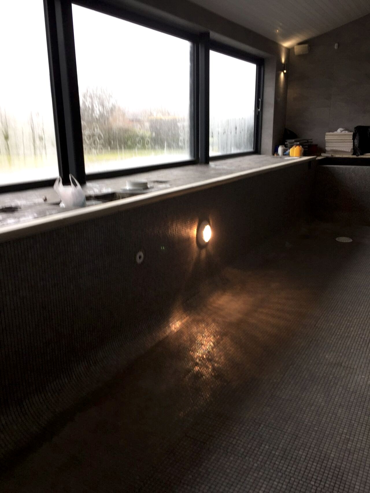 inside view of the pool with the underwater lights turned on