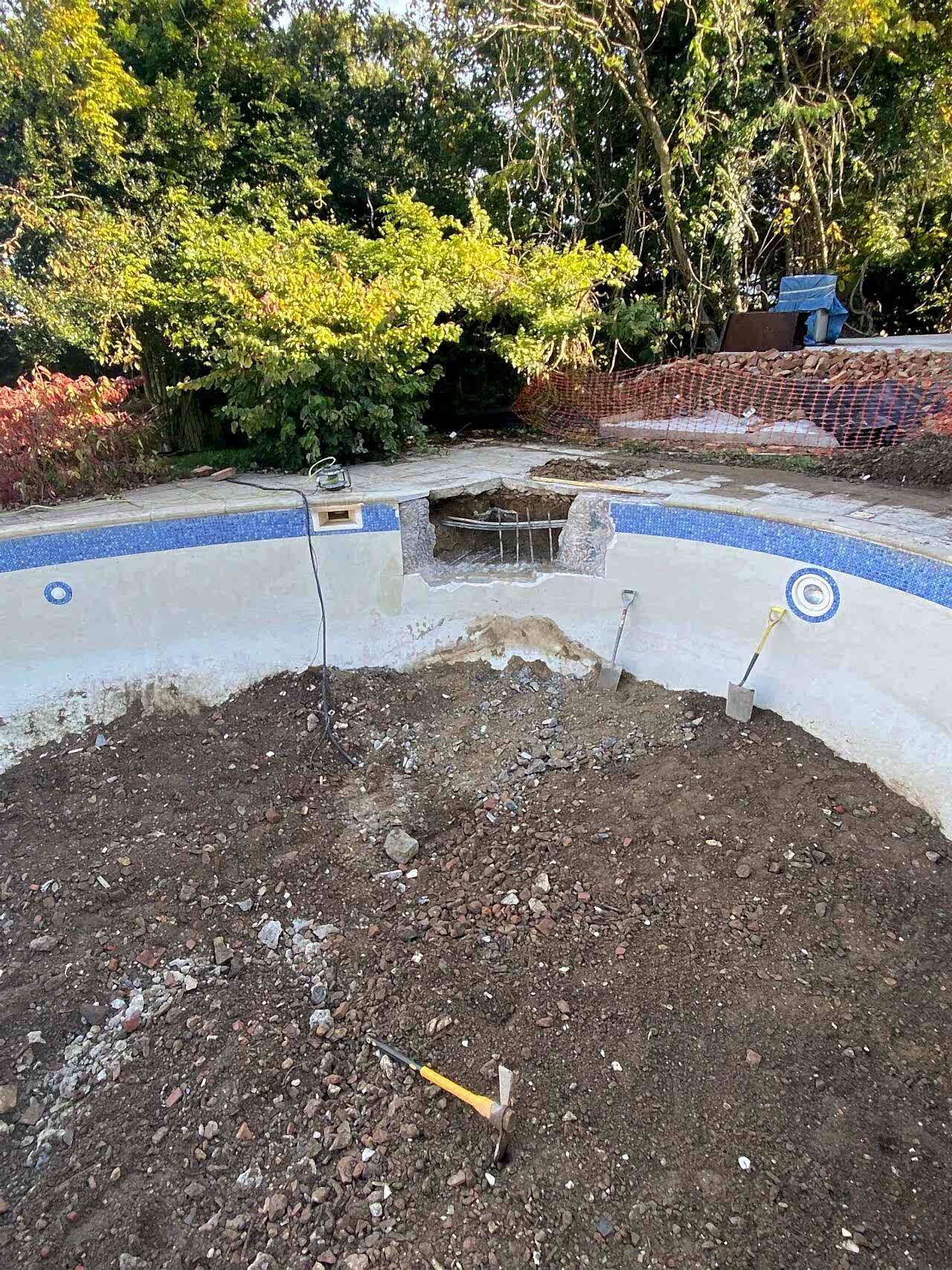 After the pool has been drained, the team of UK Swimming Pools started the deconstruction