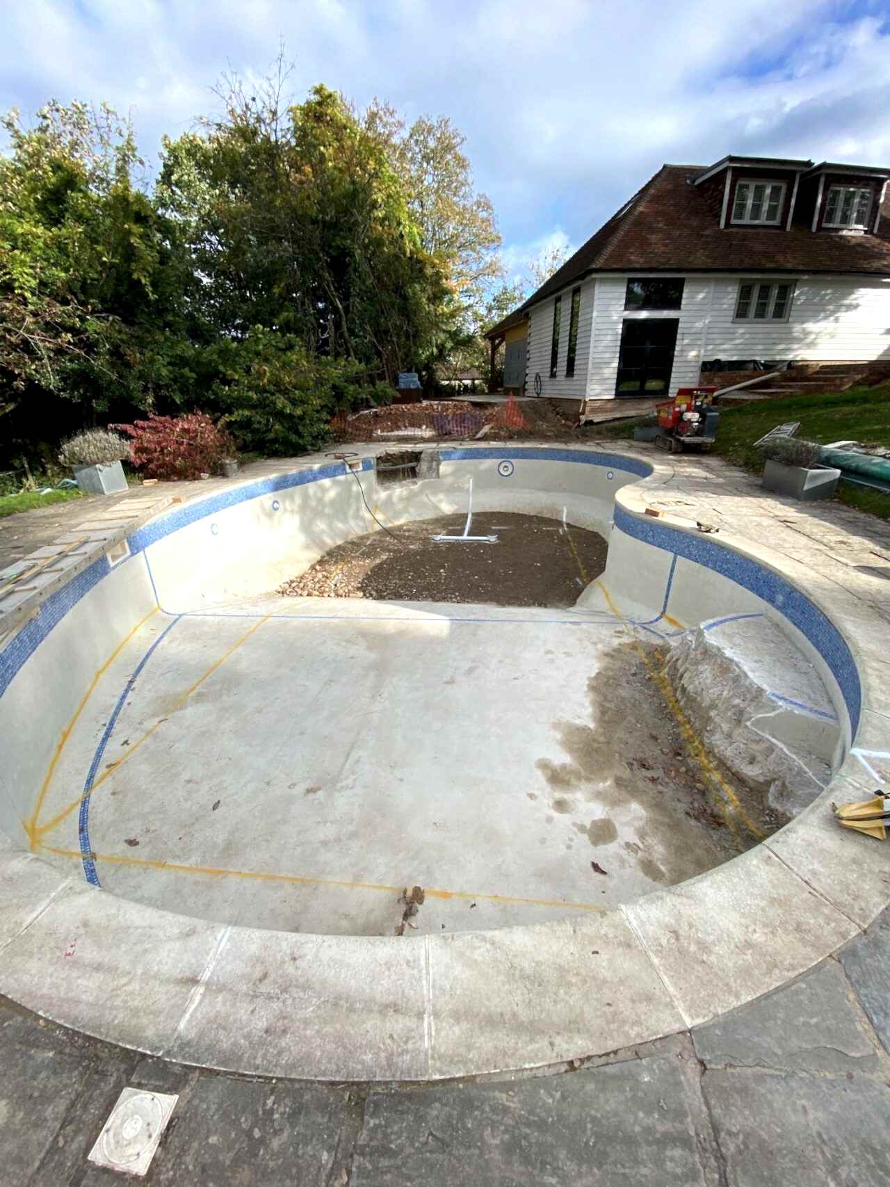 After the pool has been drained, the team of UK Swimming Pools started the deconstruction