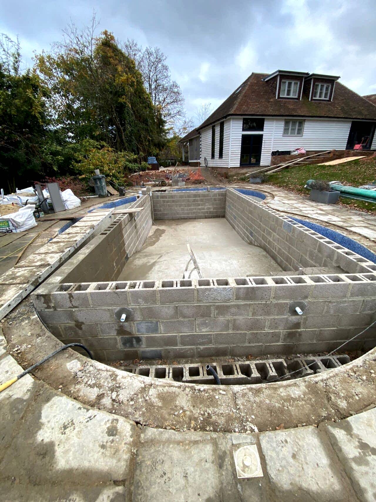 The team of UK Swimming Pools was constructing a new reinforced concrete pool within the boundaries of the existing structure