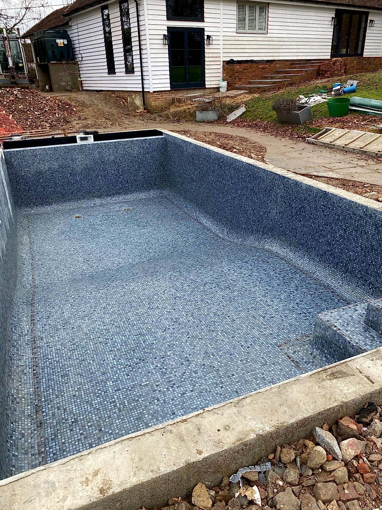 The entire swimming pool has been retiled with a new top-line mosaics by the UK Swimming Pools Team