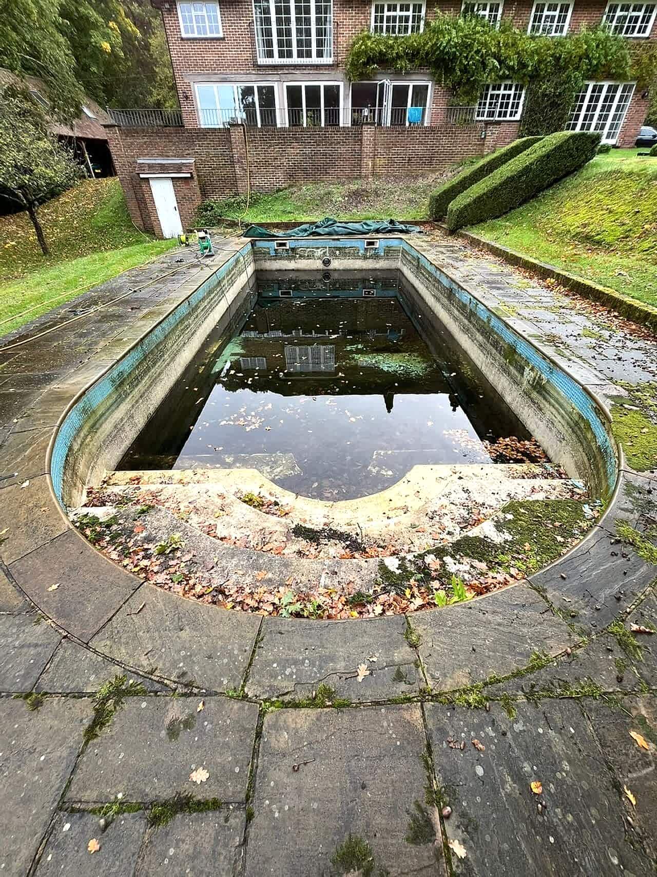 Original curved swimming pool before refurbishment started