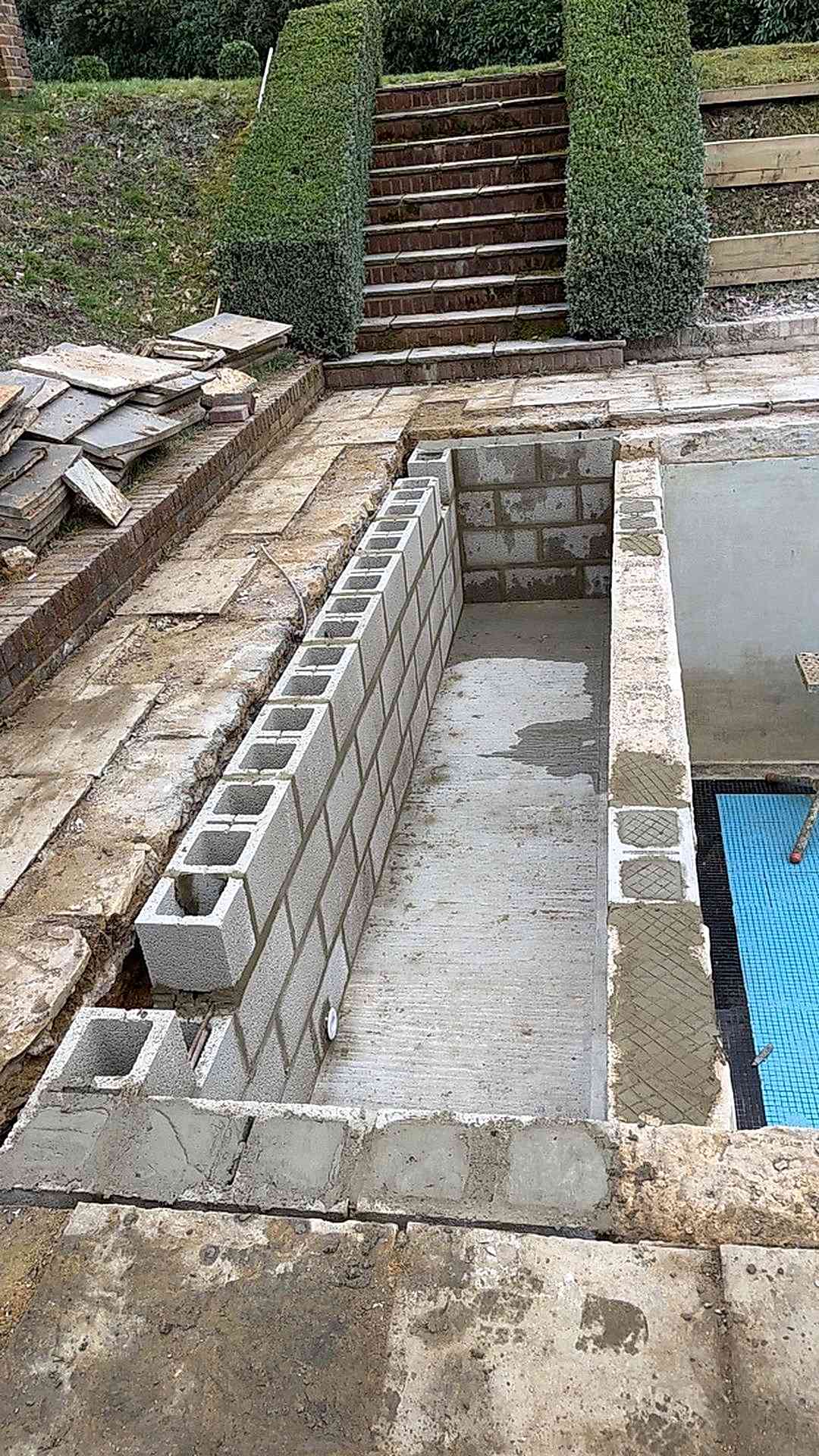 The slatted cover system could then be installed seamlessly over the newly reformed rectangular pool area
