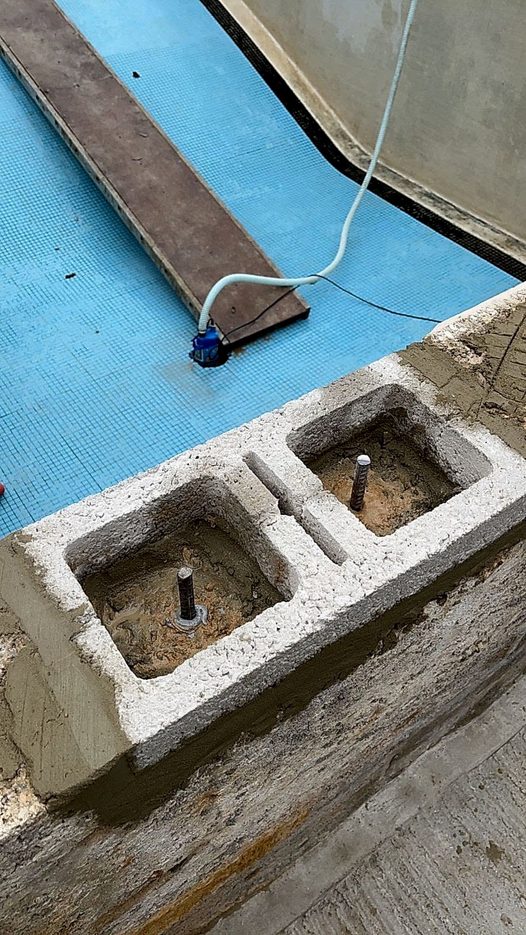 Reinforced concrete blocks being installed the enhance strength