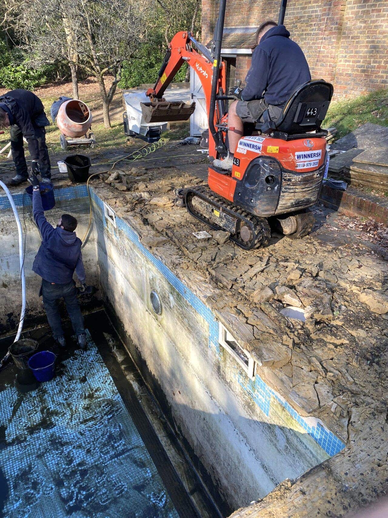 Excavation of chamber for new automatic swimming pool safety cover