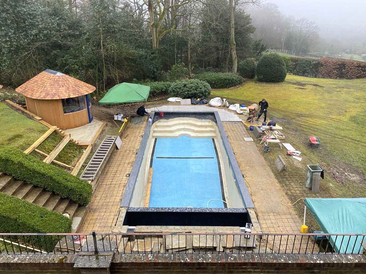 Swimming pool refurbishment showing the reinforced concrete base prior to patio being laid