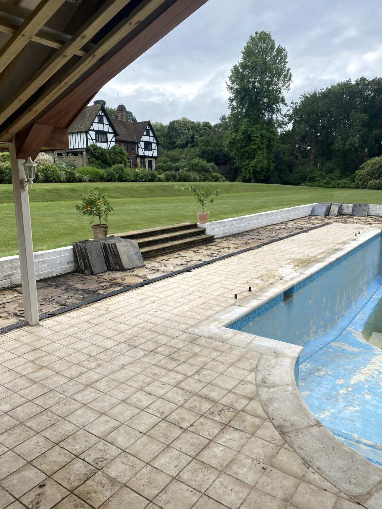 UK Swimming Pools removed the old paving surrounding the swimming pool