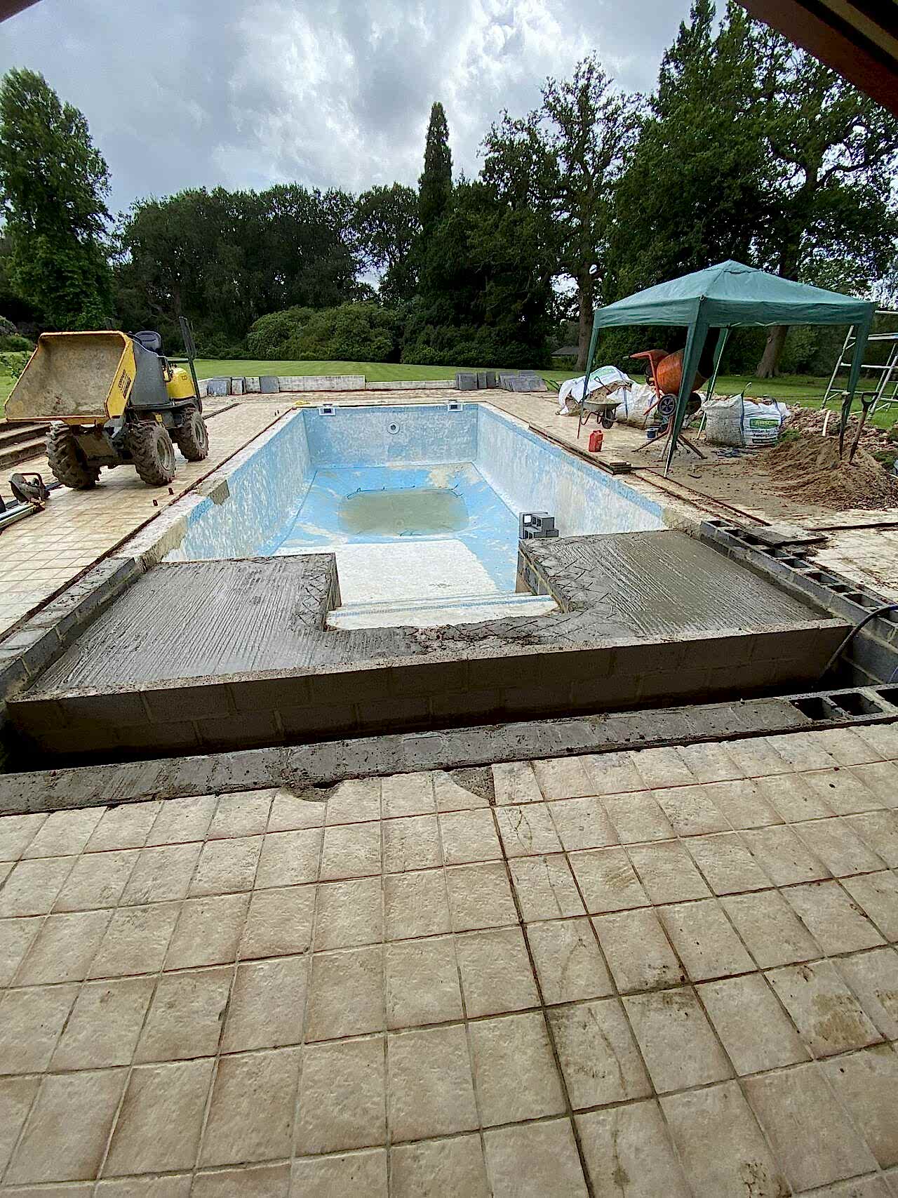 The pool renovation is in progress and the new pool is getting its shape