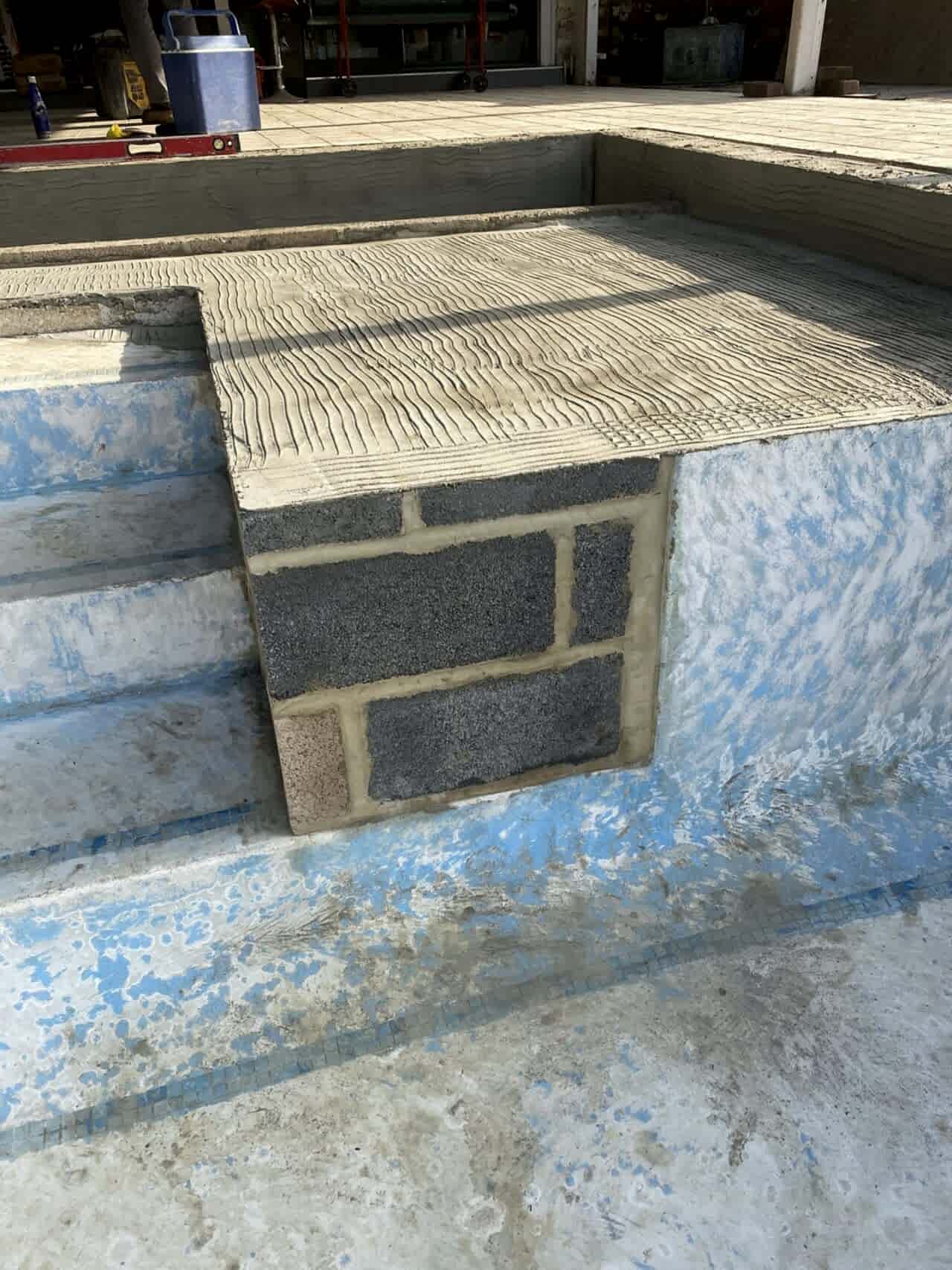 Close-up of the newly built walls for the pool