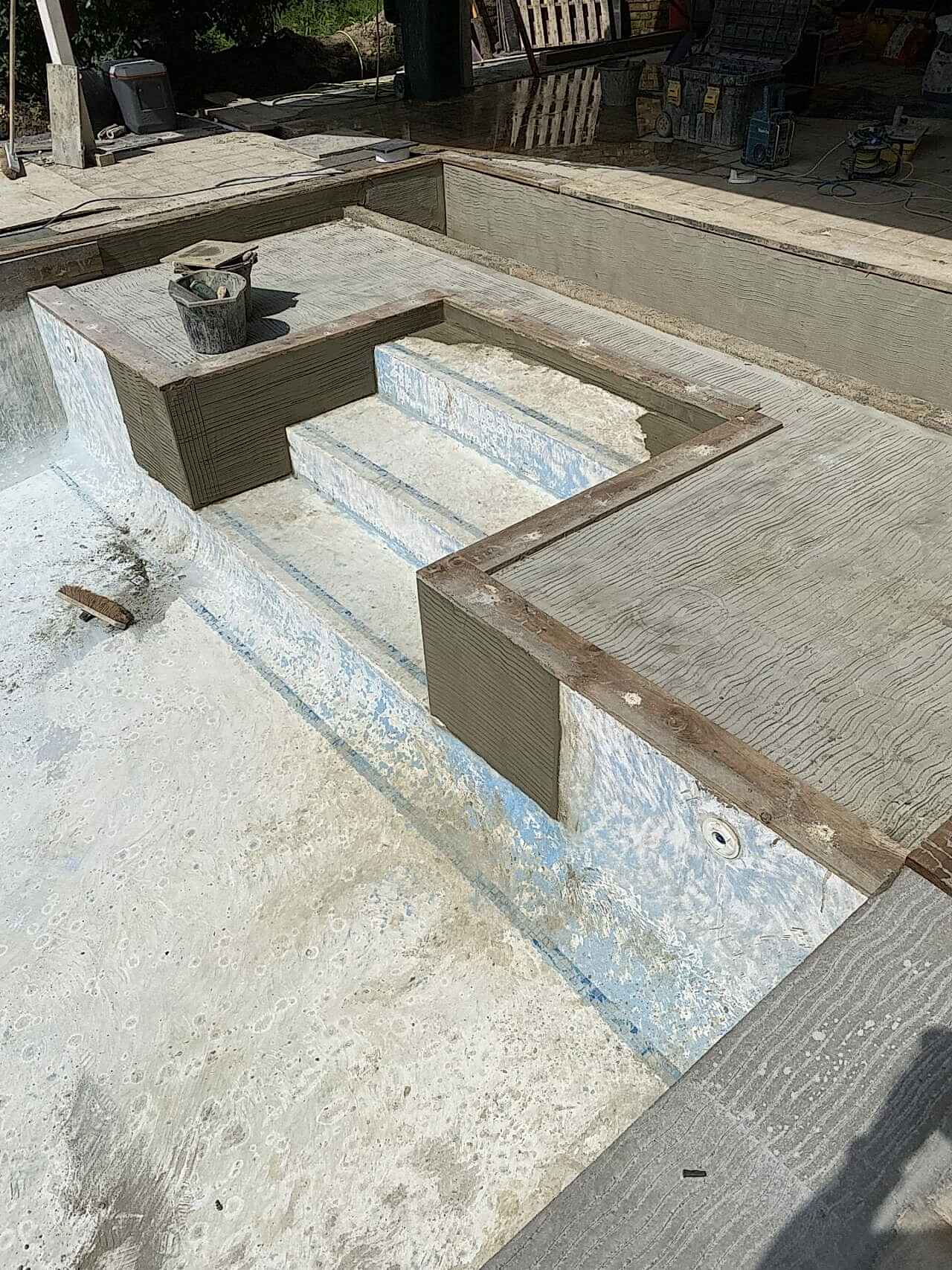 A view of the newly built walls around the swimming pool steps