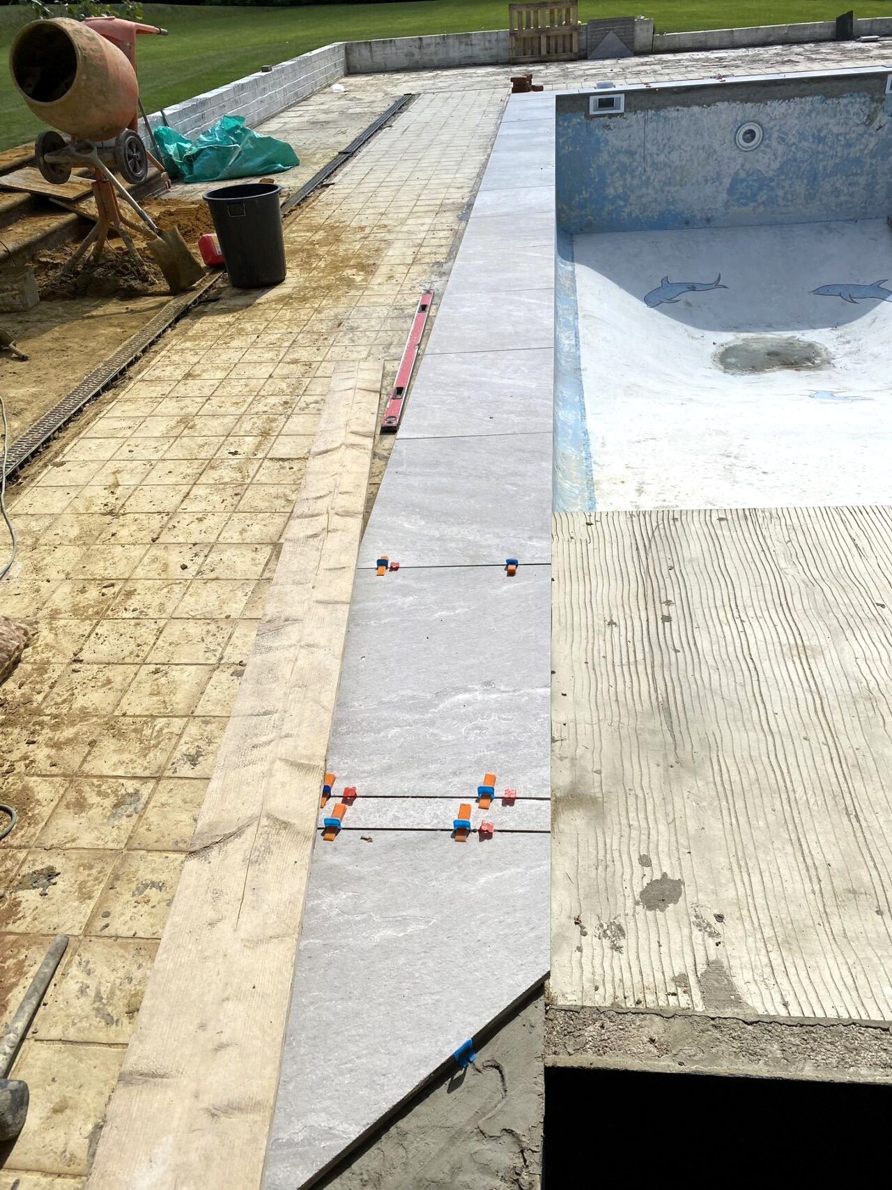 Construction is underway in and around the swimming pool