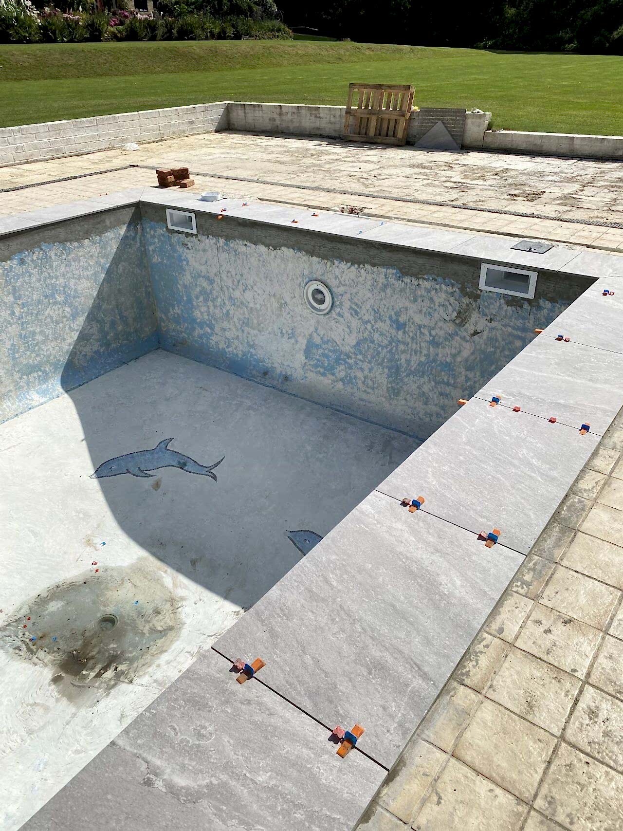 Construction is underway in and around the swimming pool