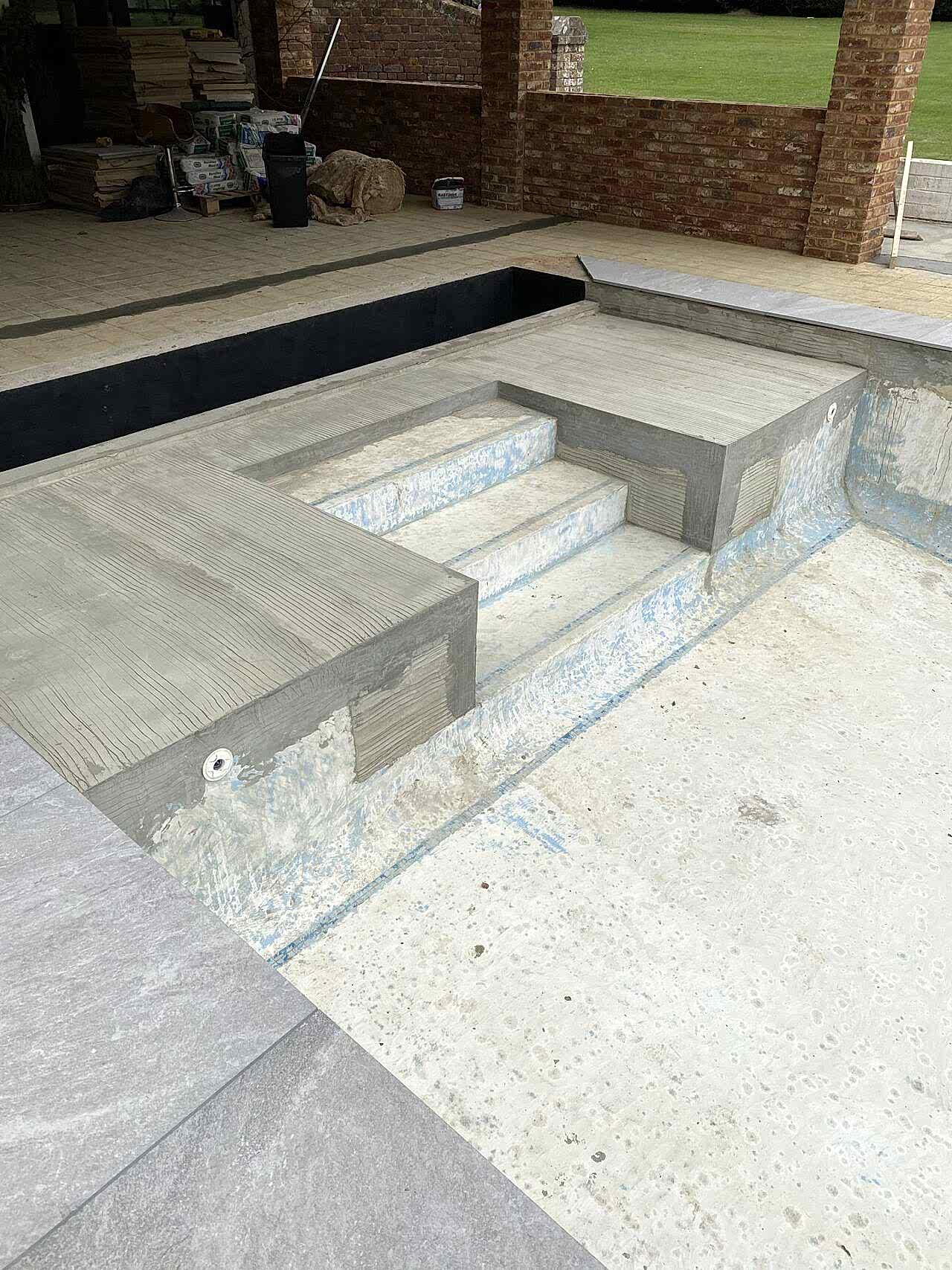 Construction is underway in and around the swimming pool