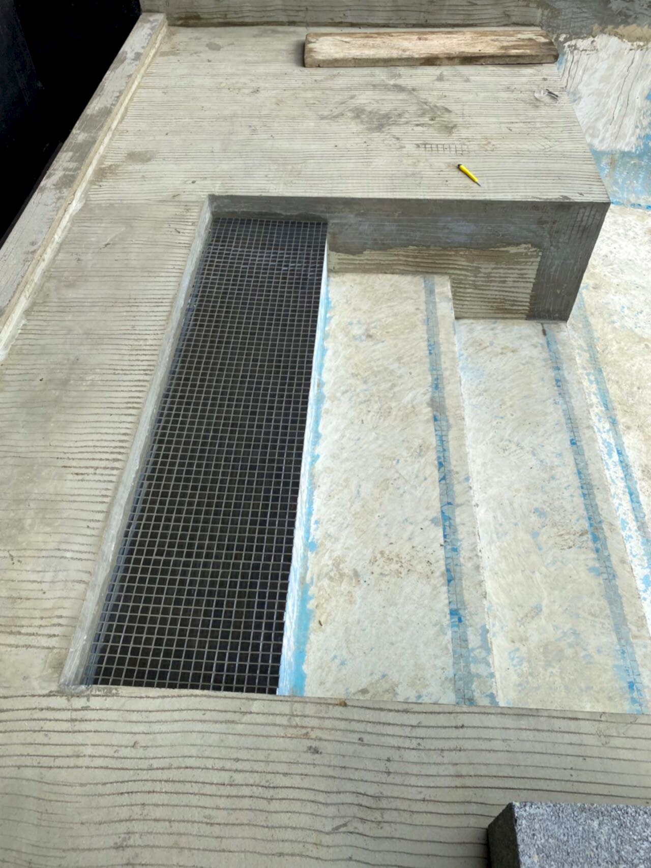 Close-up of the new tiling on the top of the stairs