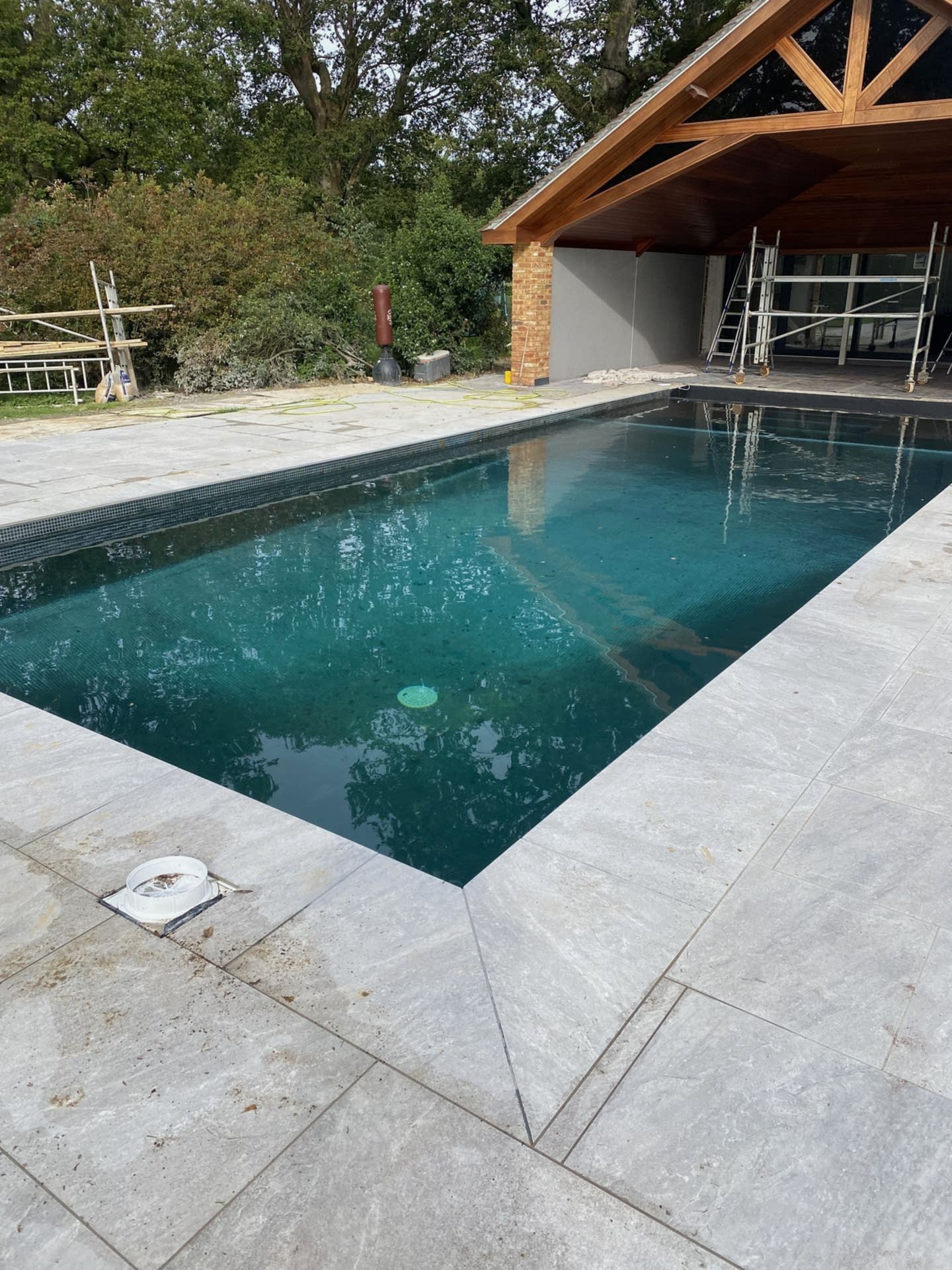Fully renovated outdoor swimming pool with pool house