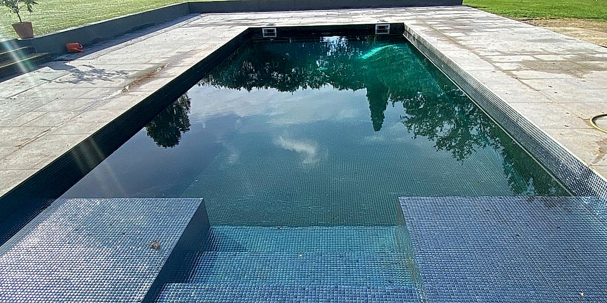 Completely renovated concrete outdoor swimmin pool
