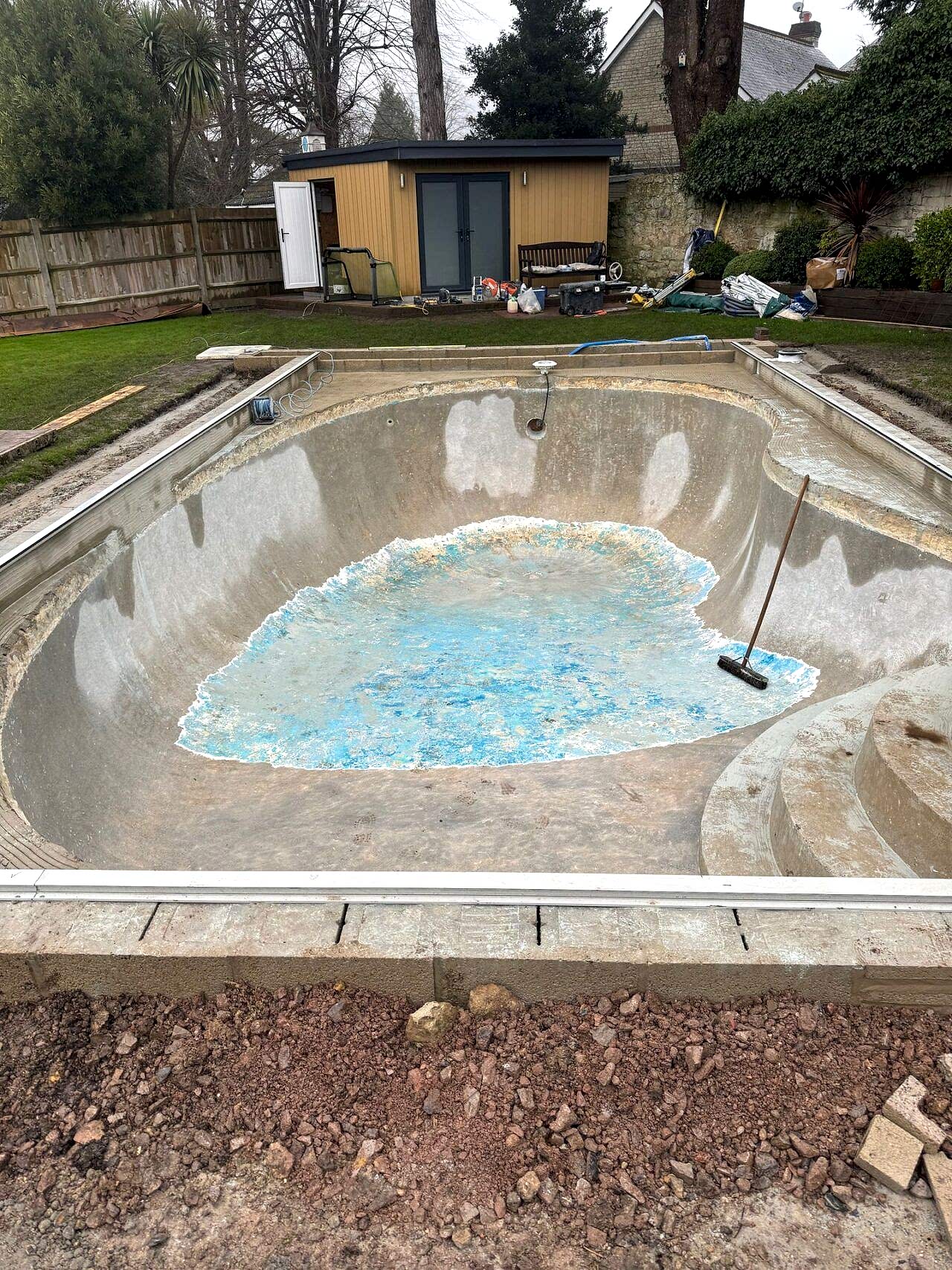 The old tiles have been mostly removed and the new pool edge has been finished