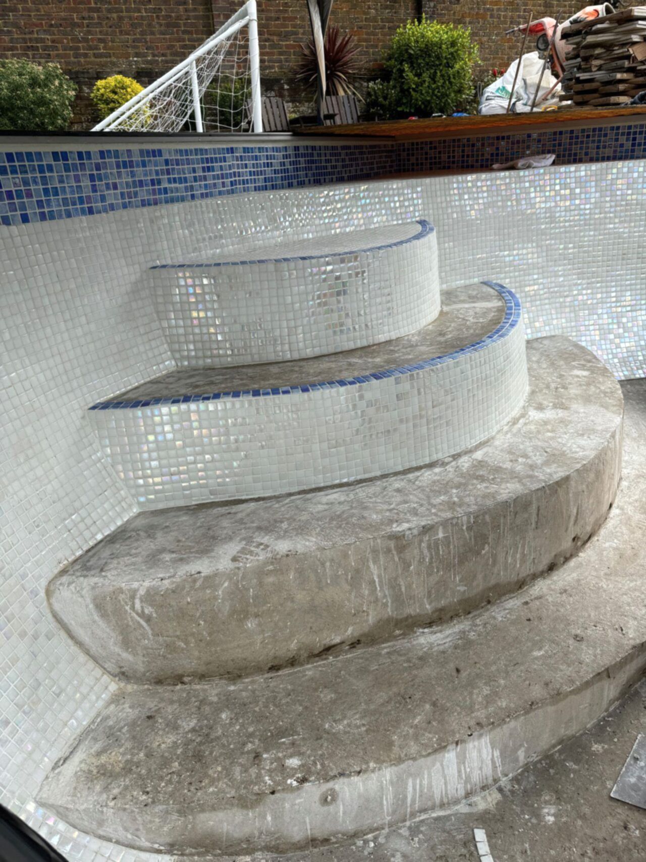 Close-up of the steps before the installation of the Ibiza 23.5mm iridescent glass mosaics