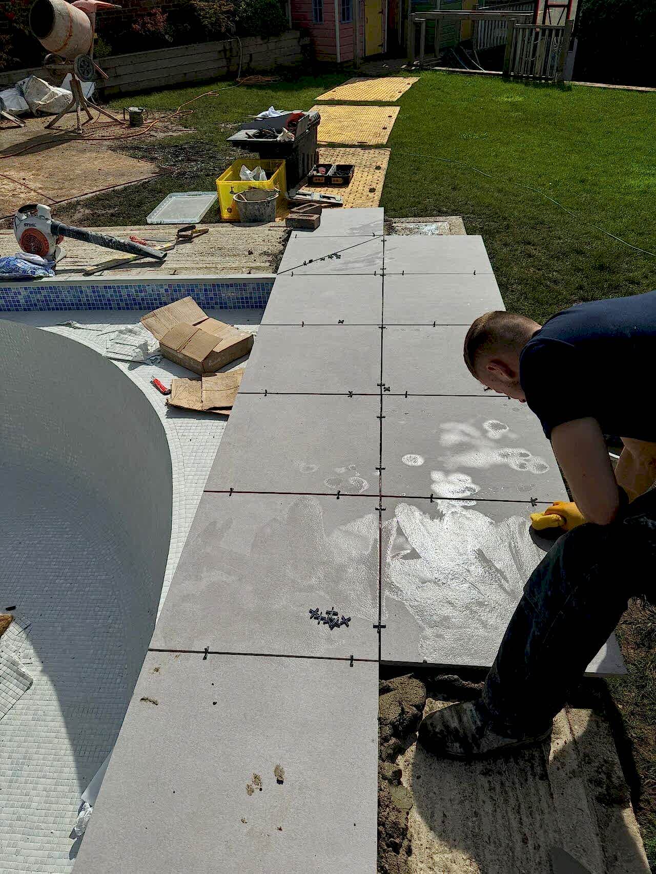Pavings are being installed around the pool