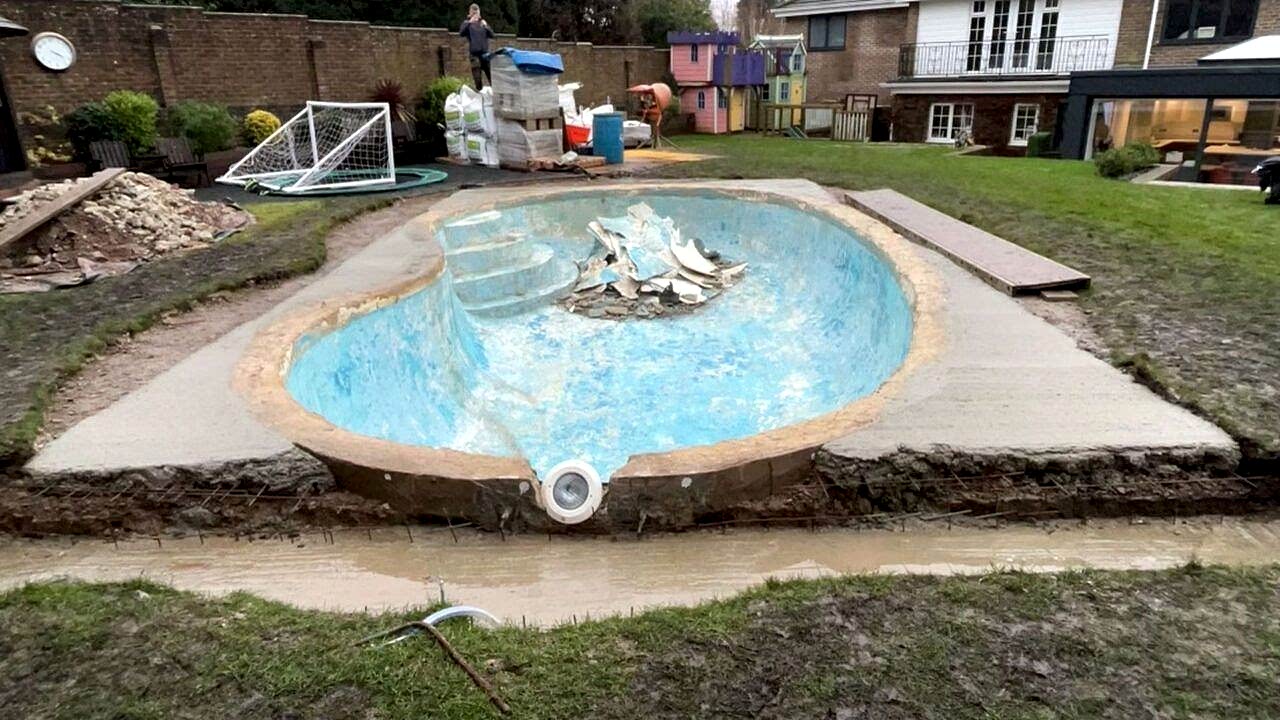 Rubble from the old mosaic tiling in the middle of the kidney shaped swimming pool