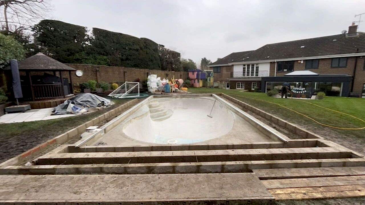 wide angle view of the refurbishment. The new edge for the pool is getting ready