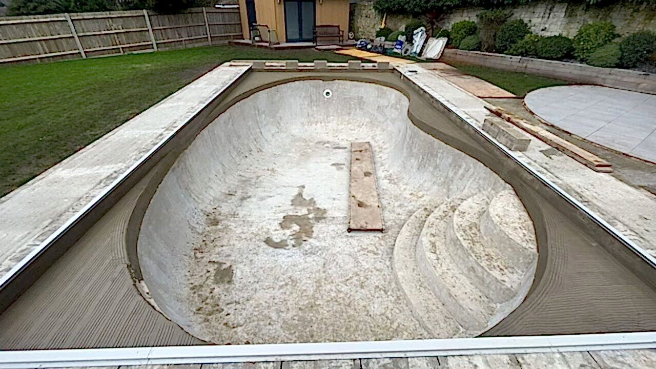 The pool gets a new layer of concrete for easy installation of the Ibiza iridescent glass mosaics