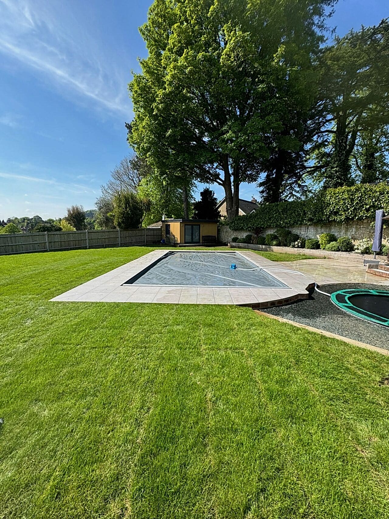 Finished shot of the remodelled of the swimming pool with cover